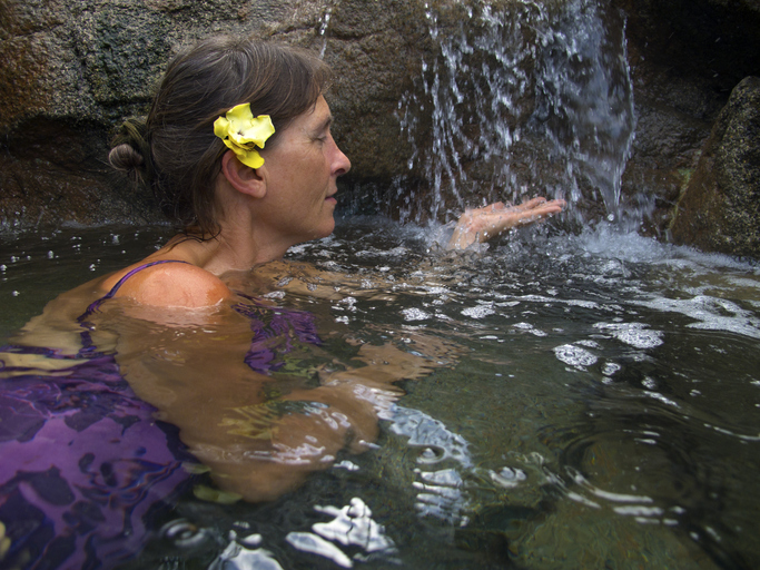 vacation rentals with hot tub woman feeling water